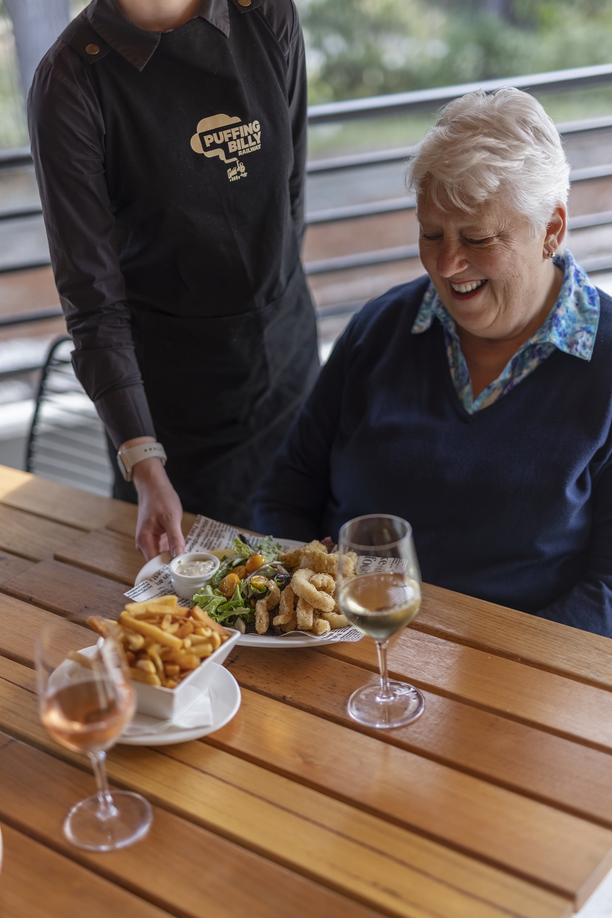 A Visitor Of The Lakeside Visitor Centre Enjoying Lunch And A Glass Of Wine