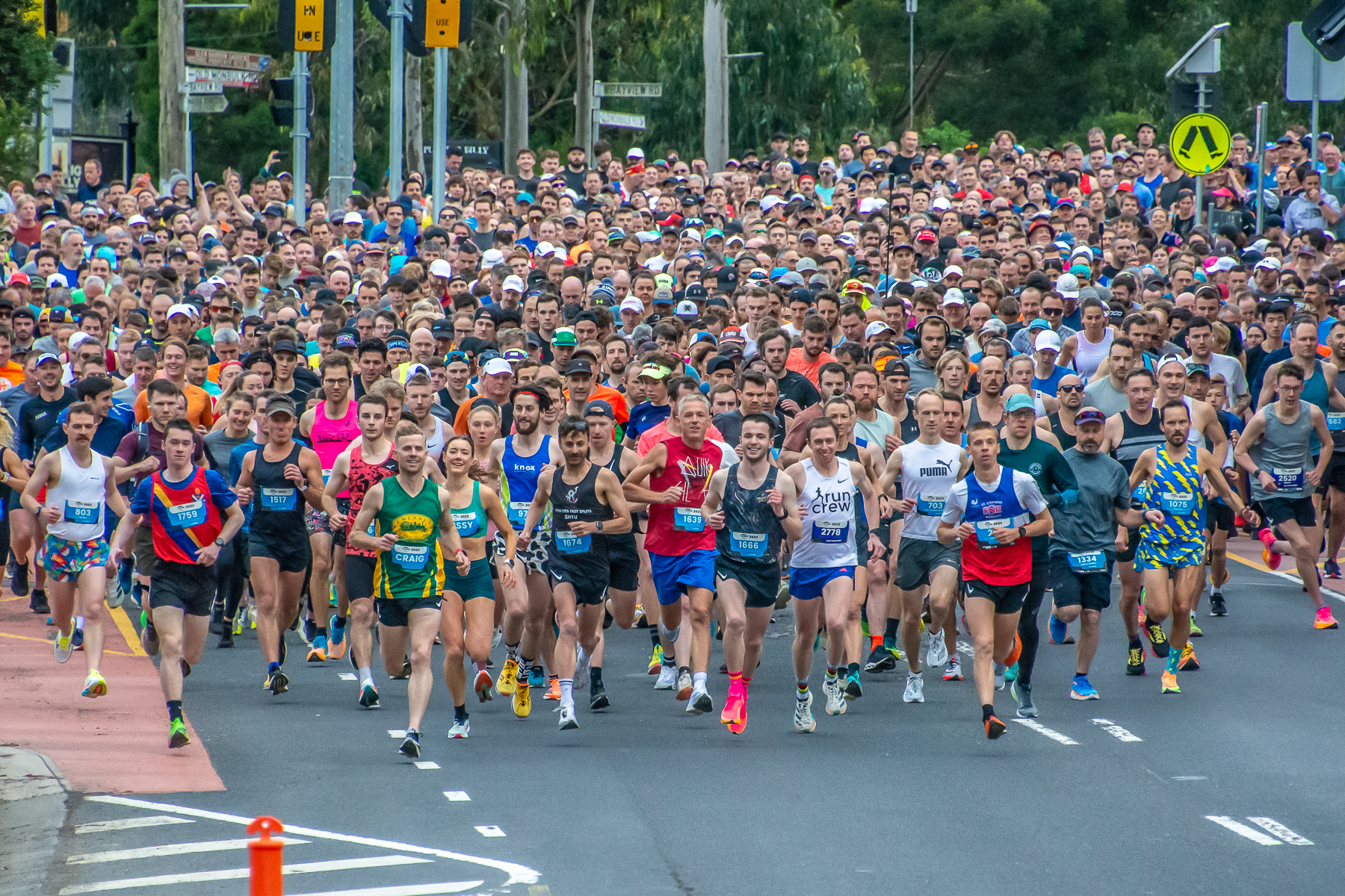 A field of runners on a road.
