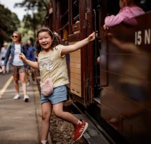 Puffing Billy Girl Stepping Off Carriage At Lakeside Station