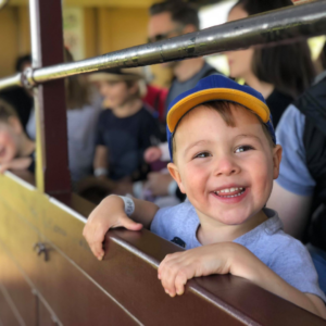 Train ride with James in Puffing Billy's traditional open side carriages
