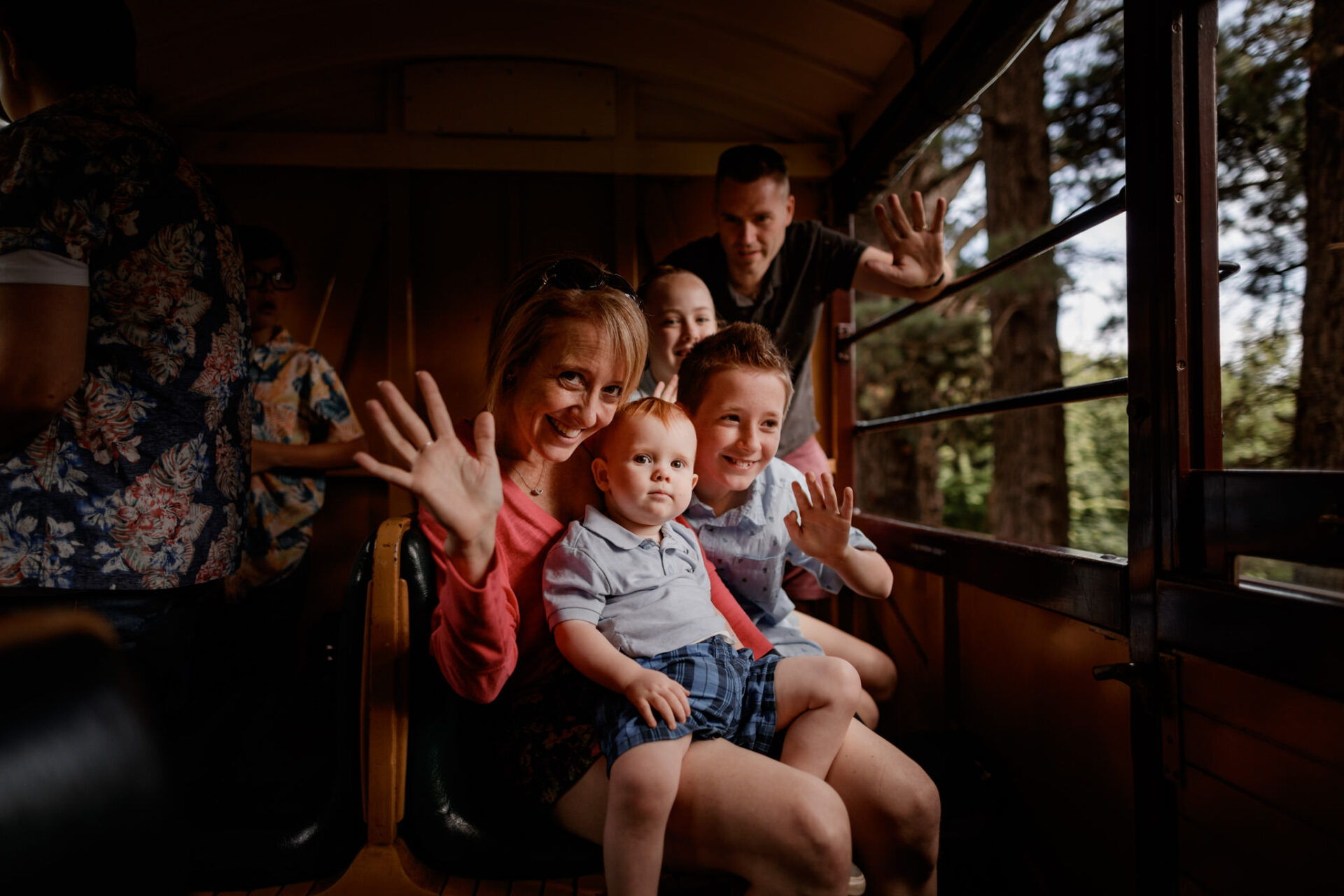 Young Family Waving Onboard