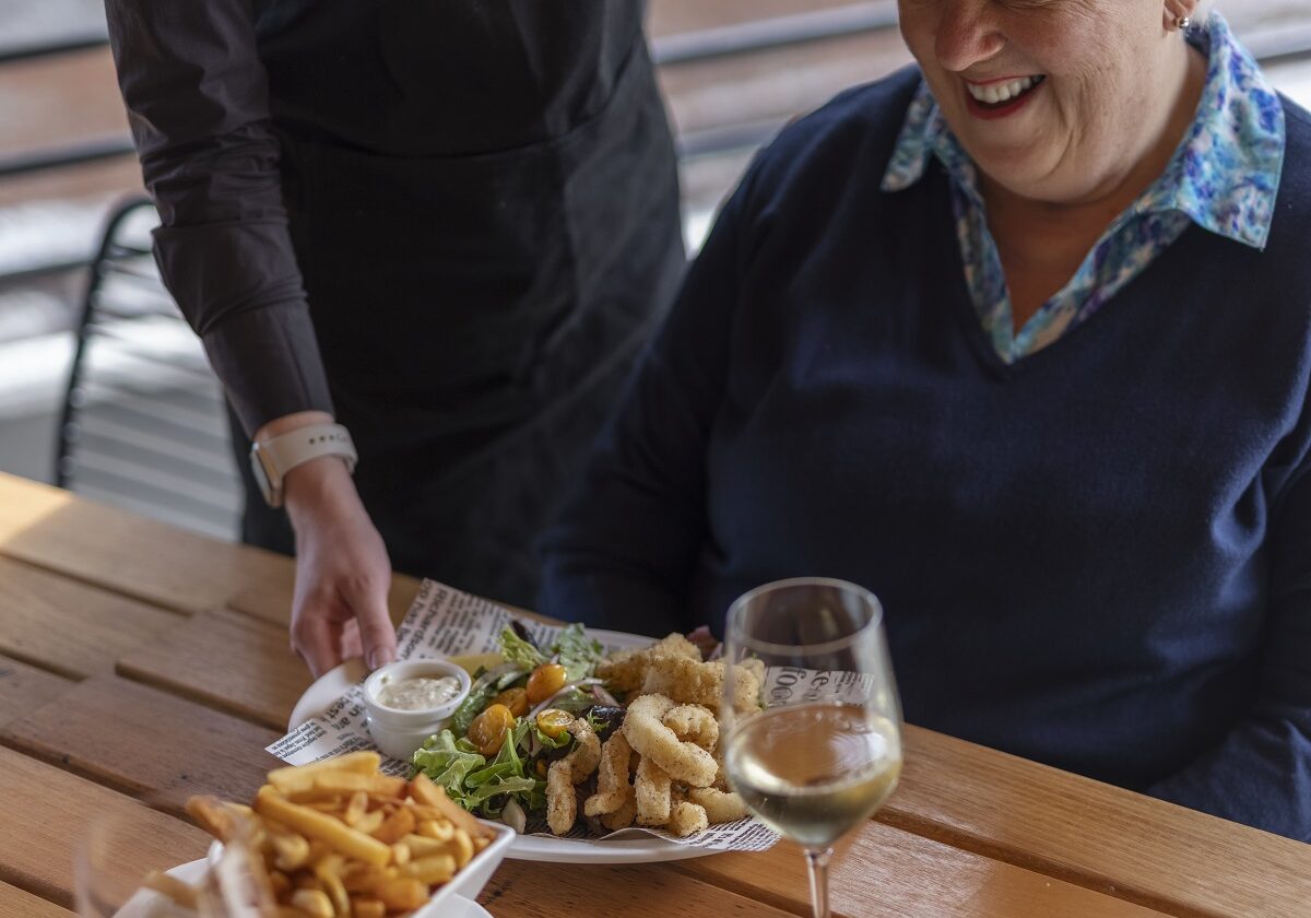 A Visitor Of The Lakeside Visitor Centre Enjoying Lunch And A Glass Of Wine