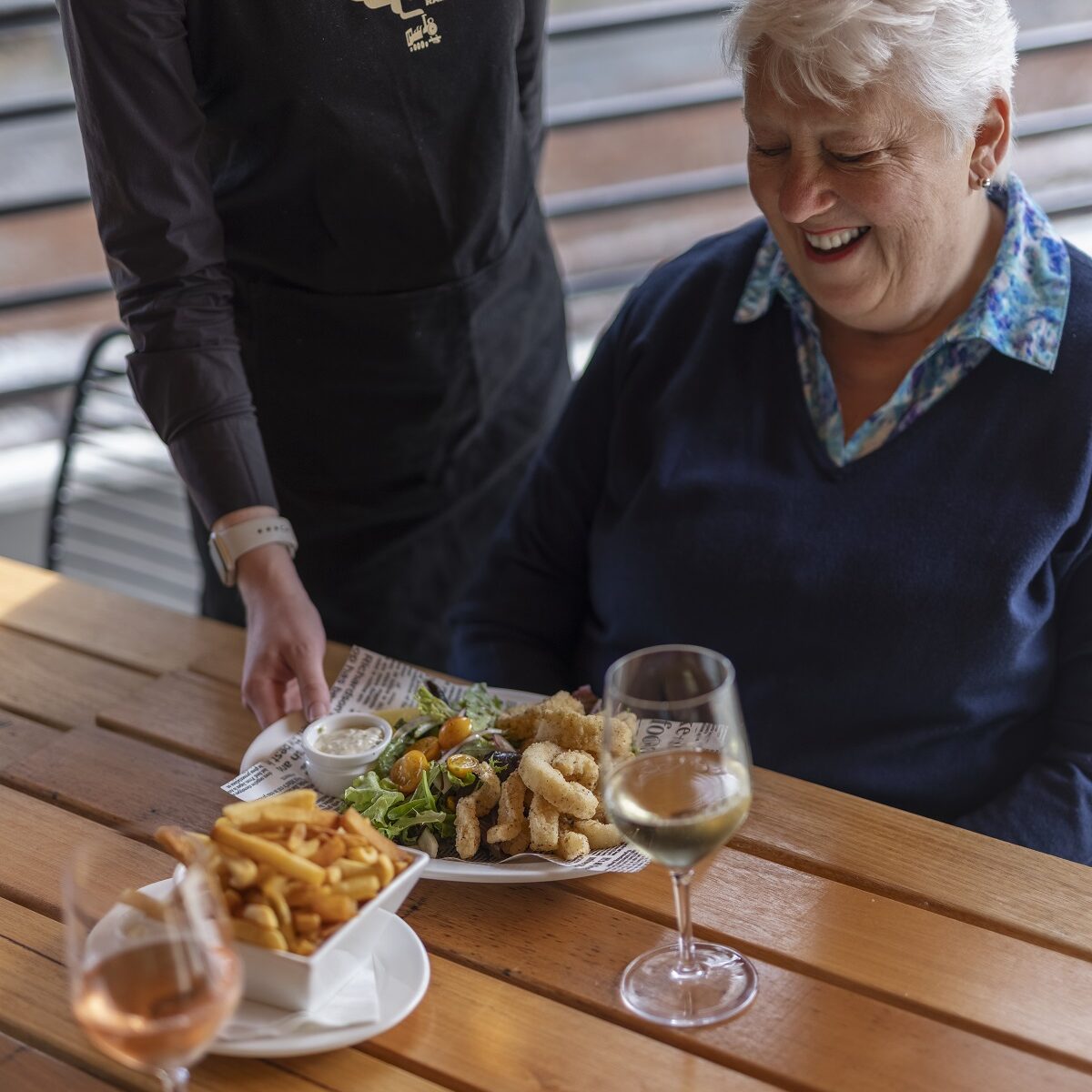 A Visitor Of The Lakeside Visitor Centre Enjoying Lunch And A Glass Of Wine