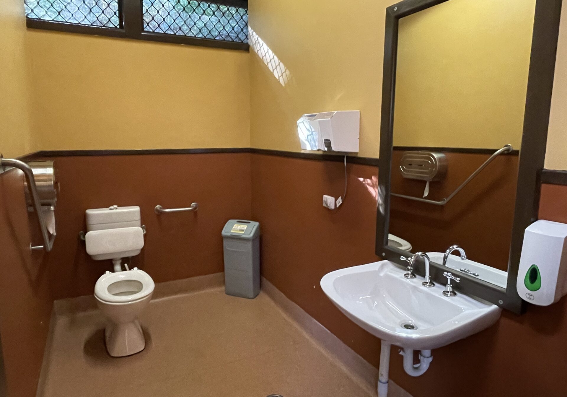 Accessible bathroom on the Lakeside station platform with guardrail installed.