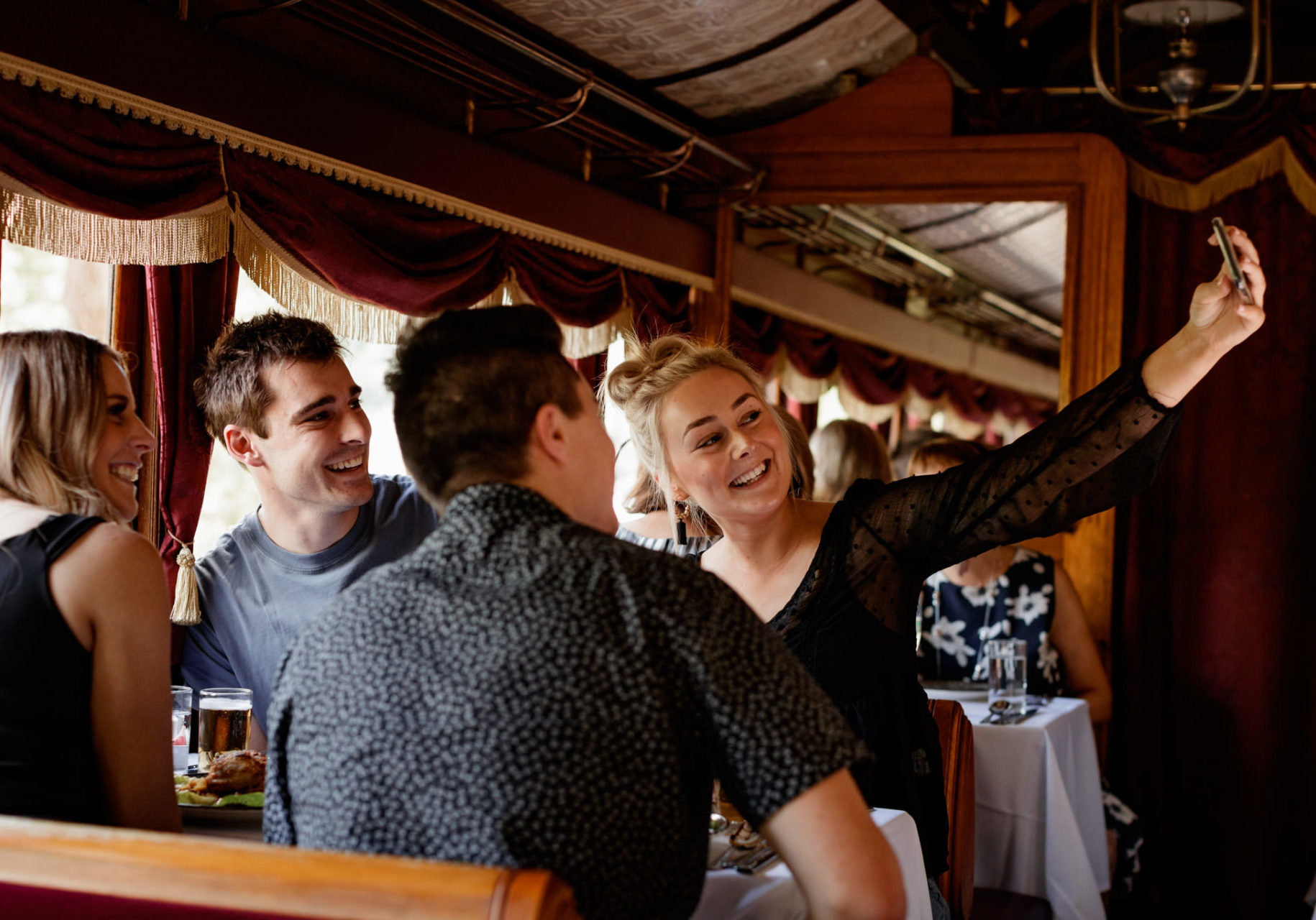 Young Couples Taking Selfie On Board Luncheon Train